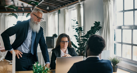 employee looking at computer monitor