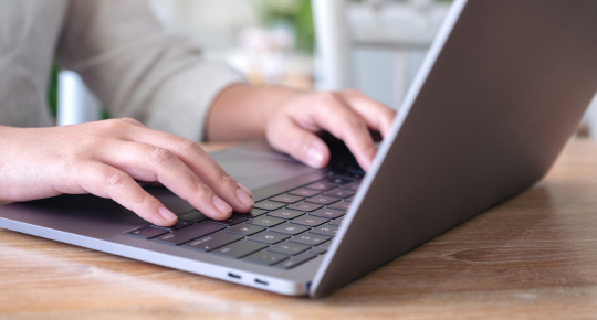 woman's hands typing